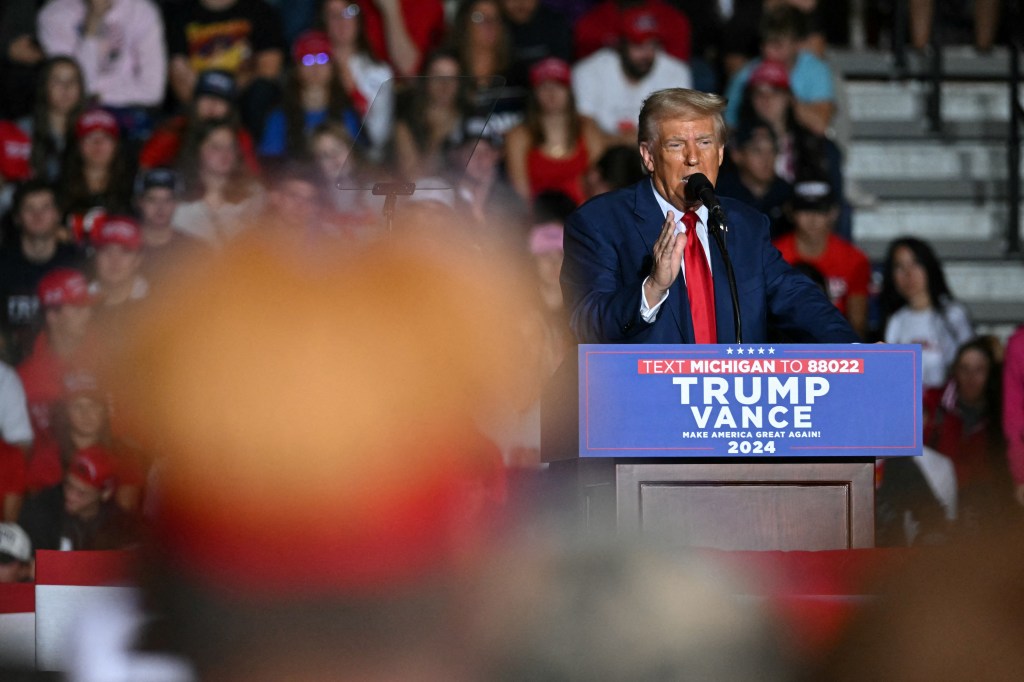  Donald Trump speaks during a campaign event at the Ryder Center for Health and Physical Education at Saginaw Valley State University in Saginaw, Michigan, on October 3, 2024. 