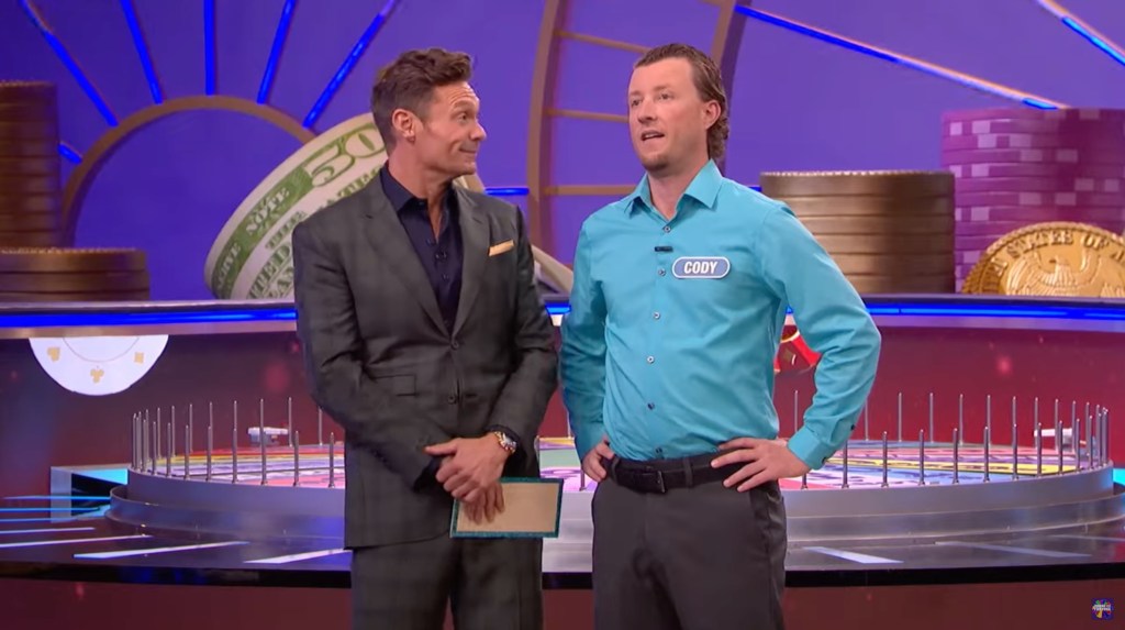 Ryan Seacrest and contestant Cody Hunger on "Wheel of Fortune."