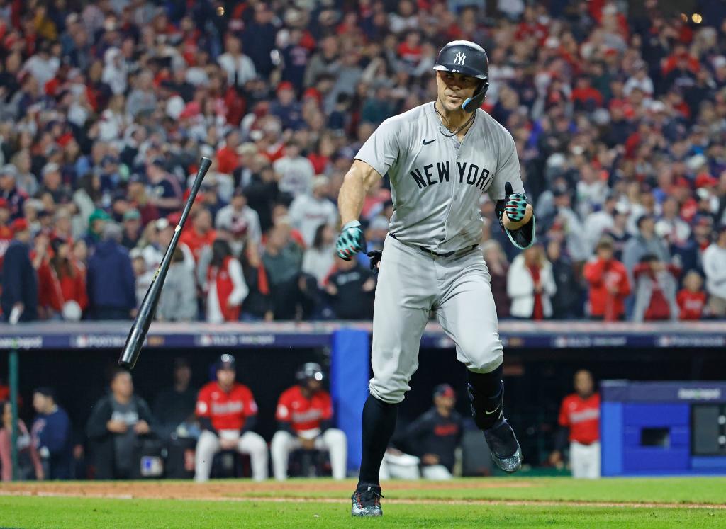 Giancarlo Stanton #27 of the New York Yankees reacts as he rounds the bases on his two-run home run in ALCS Game 5.