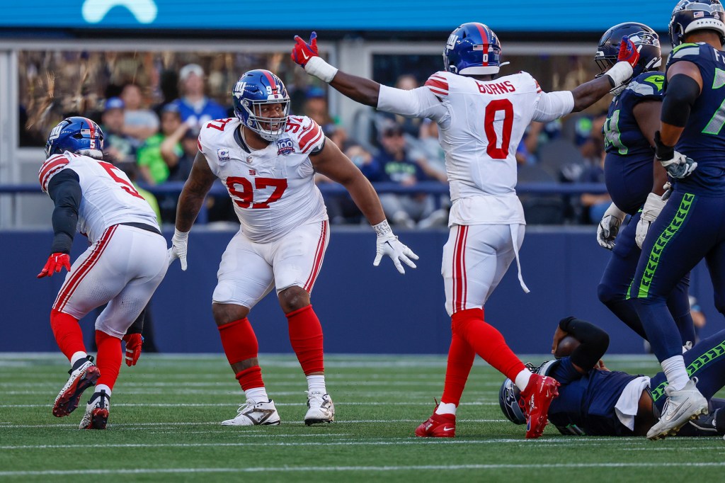 Dexter Lawrence (97) and Brian Burns (0) celebrate a sack during the Giants' win on Oct. 6.