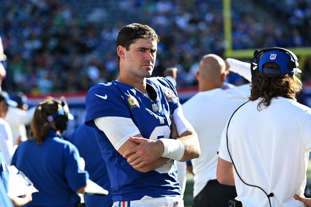 Giants quarterback Daniel Jones with his arms crossed looking upset after being benched during a game against the Philadelphia Eagles