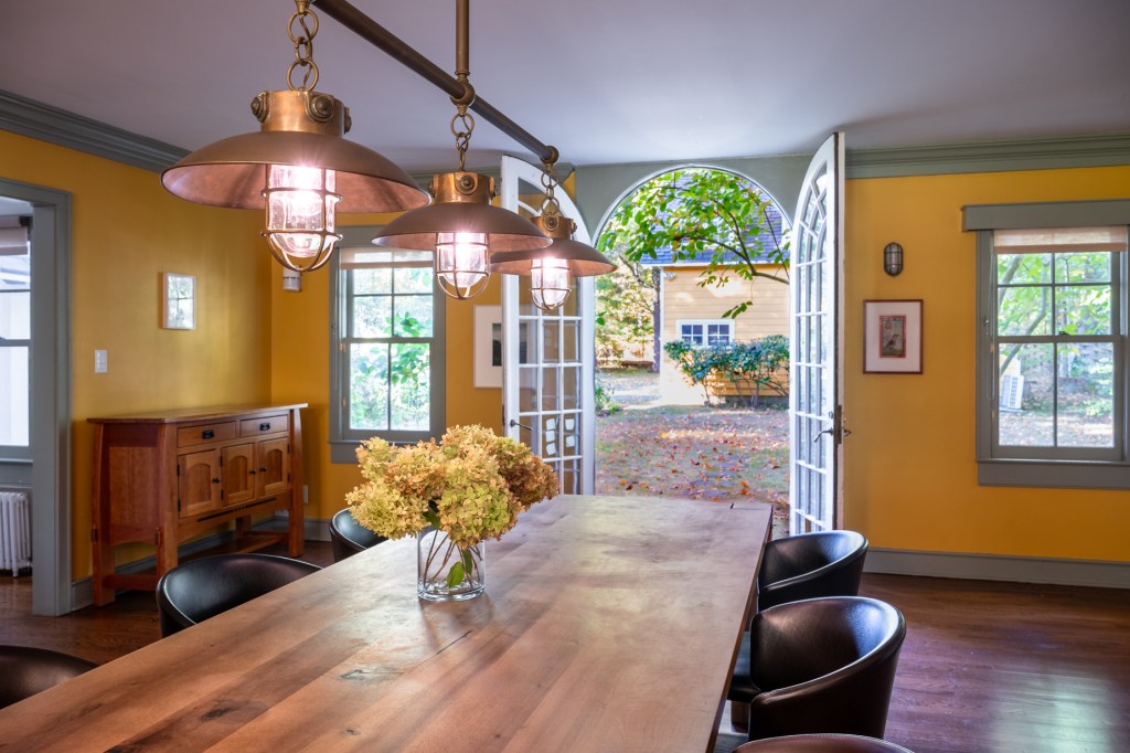 The kitchen leads outdoors to the grounds of the estate.