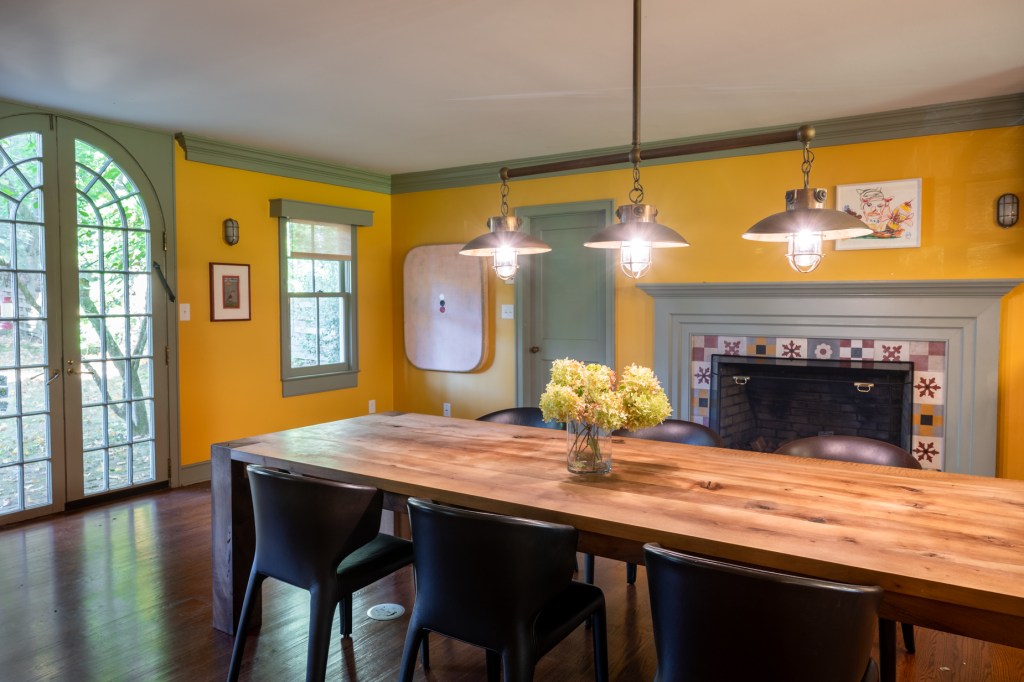 The kitchen is accented with a charming fireplace and plenty of eat-in space.