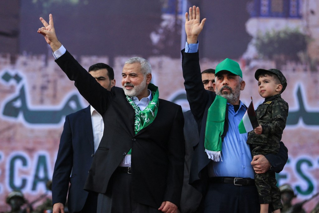 Sinwar with Hamas leader Ismail Haniya (left) at a ceremony on the 30th anniversary of the Islamist movement in Gaza City on Dec. 4, 2017.