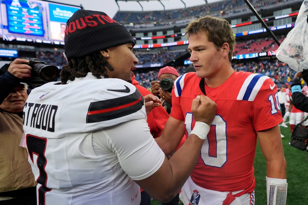 New England Patriots quarterback Drake Maye (10) and Houston Texans quarterback C.J. Stroud (7) meet on the field following an NFL football game, Sunday, Oct. 13, 2024, in Foxborough, Mass.  