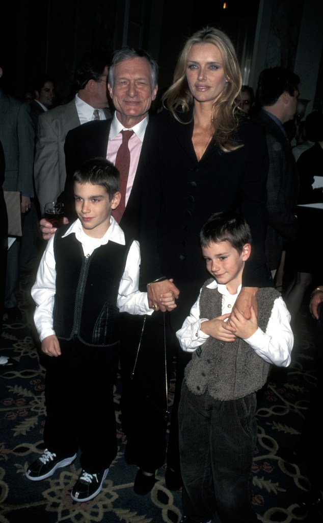 Hugh Hefner is seen above with his second wife, Kimberley Conrad, and their two sons -- Martson and Cooper.