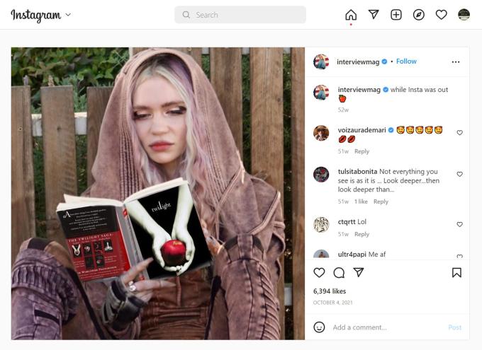 A photo of singer-songwriter Grimes reading a book.