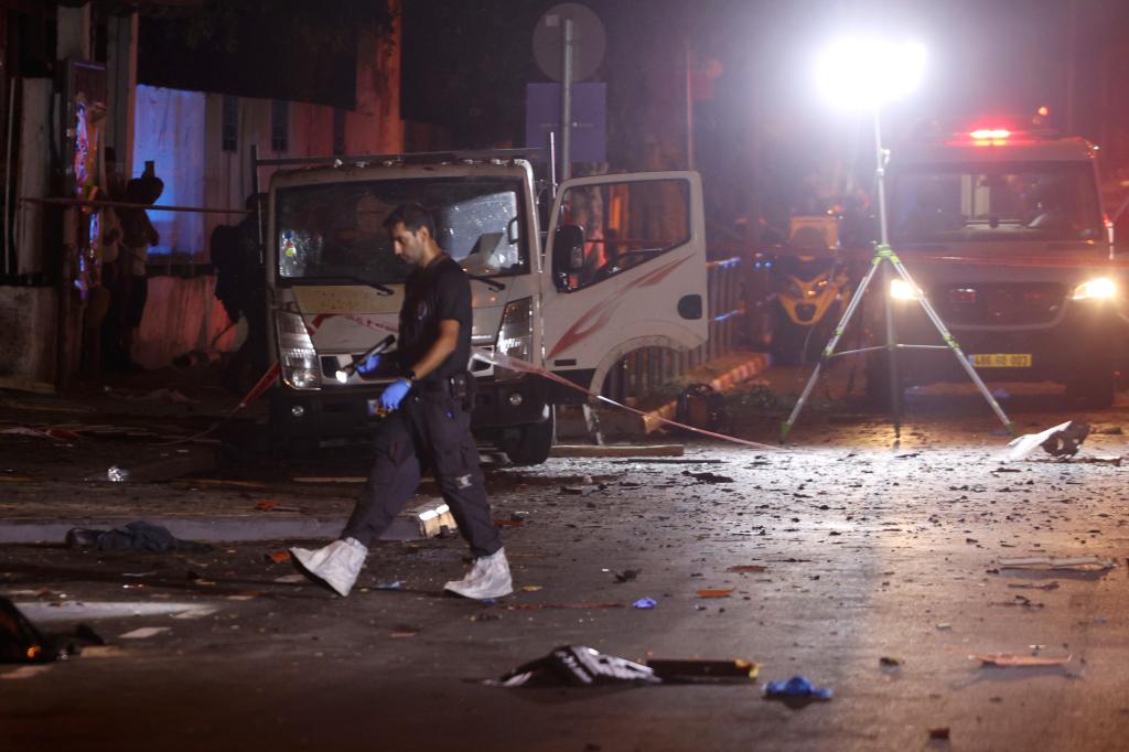 Israeli police work at the scene of a bomb explosion in Tel Aviv, Israel, Sunday, Aug. 18, 2024. I (AP Photo/Moti Milrod)