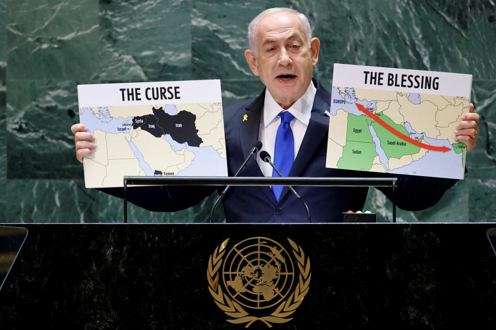 Israeli Prime Minister Benjamin Netanyahu holds up maps of Iran and Israel during his address to the United Nations General Assembly on Sept. 27, 2024.