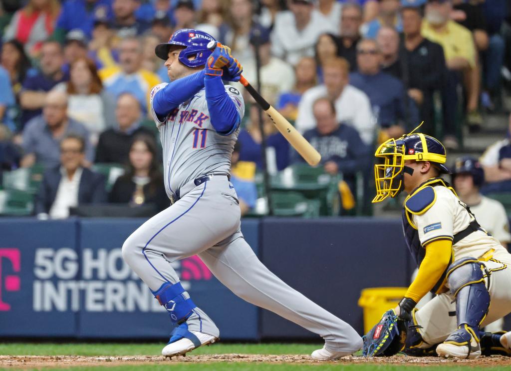 Jose Iglesias #11 of the New York Mets reaches on an RBI infield single during the fifth inning.