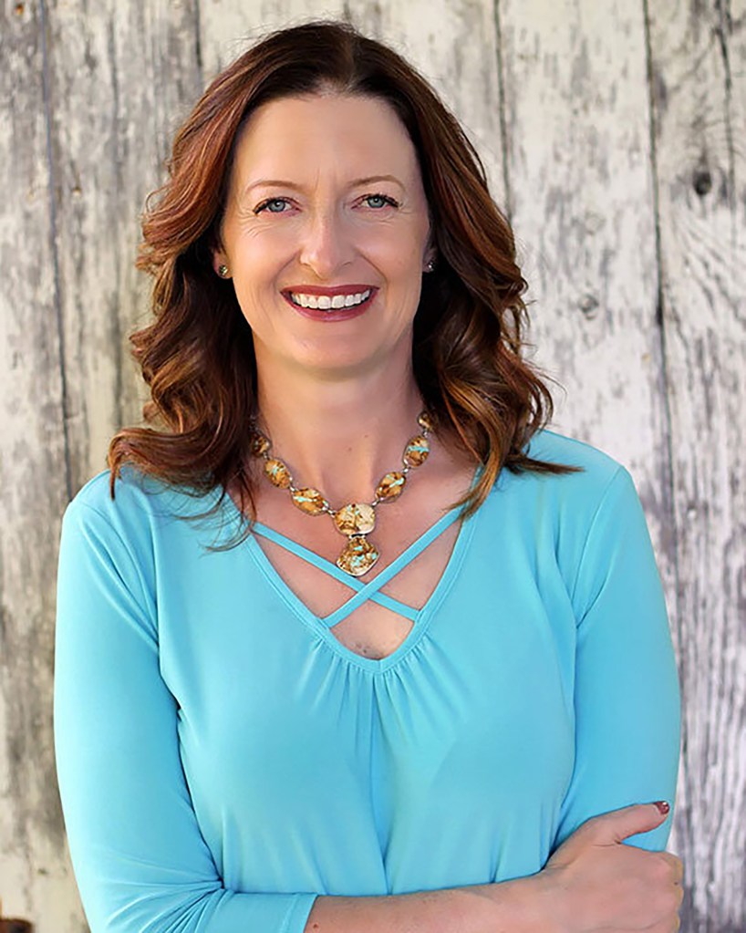 Kim Bremmer of Venture Dairy Cooperative standing at a Wisconsin farm