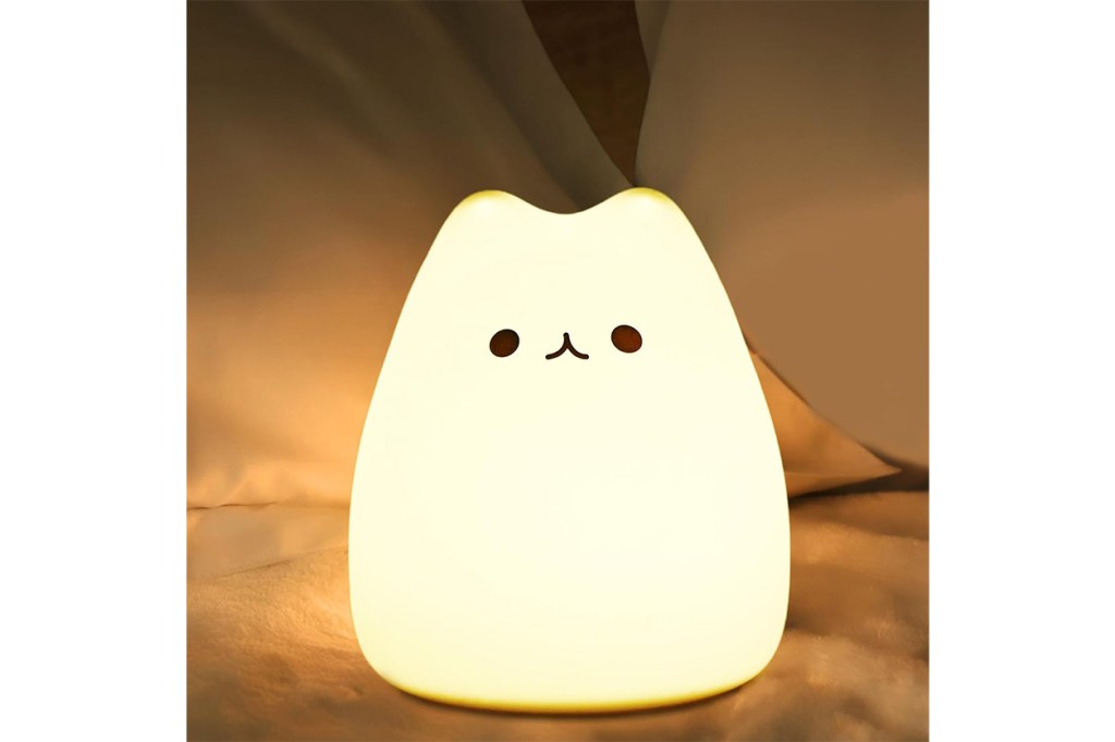 A lit cat shaped lamp