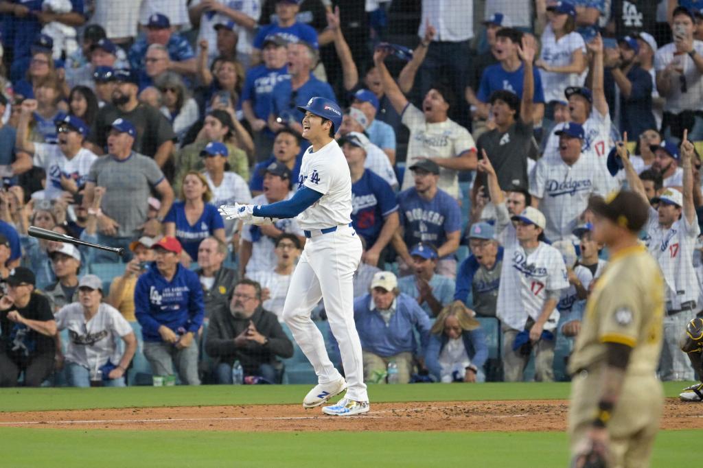 Dodgers designated hitter Shohei Ohtani (17) hits a home run during Game 1 of the NLDS.