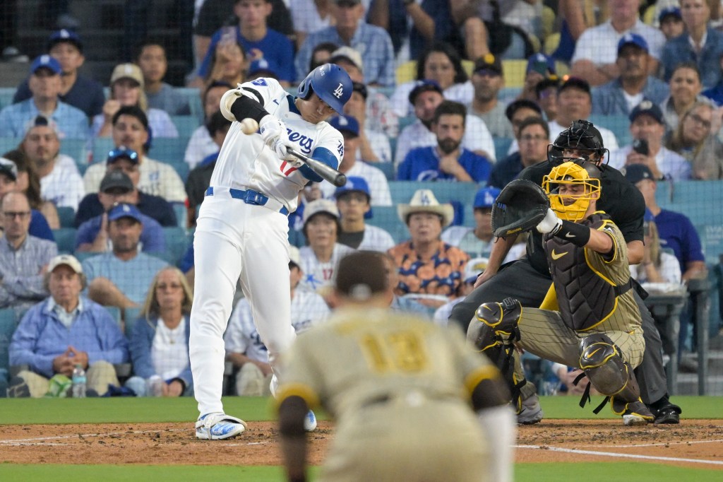 Dodgers designated hitter Shohei Ohtani (17) hits a home run during Game 1 of the NLDS.