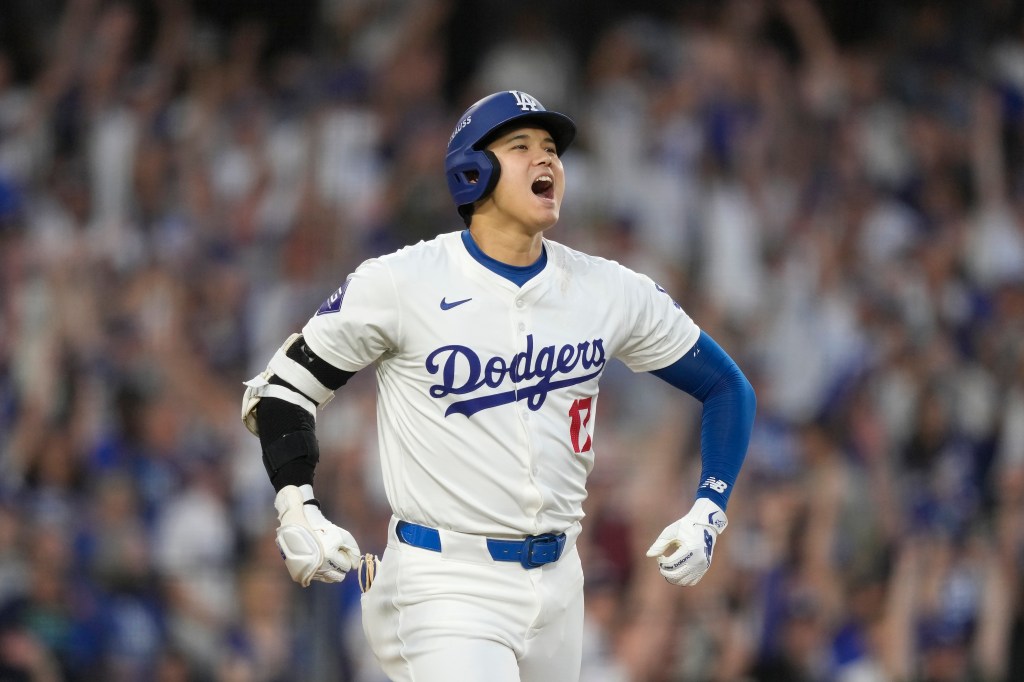 odgers' Shohei Ohtani reacts after hitting a three-run home run