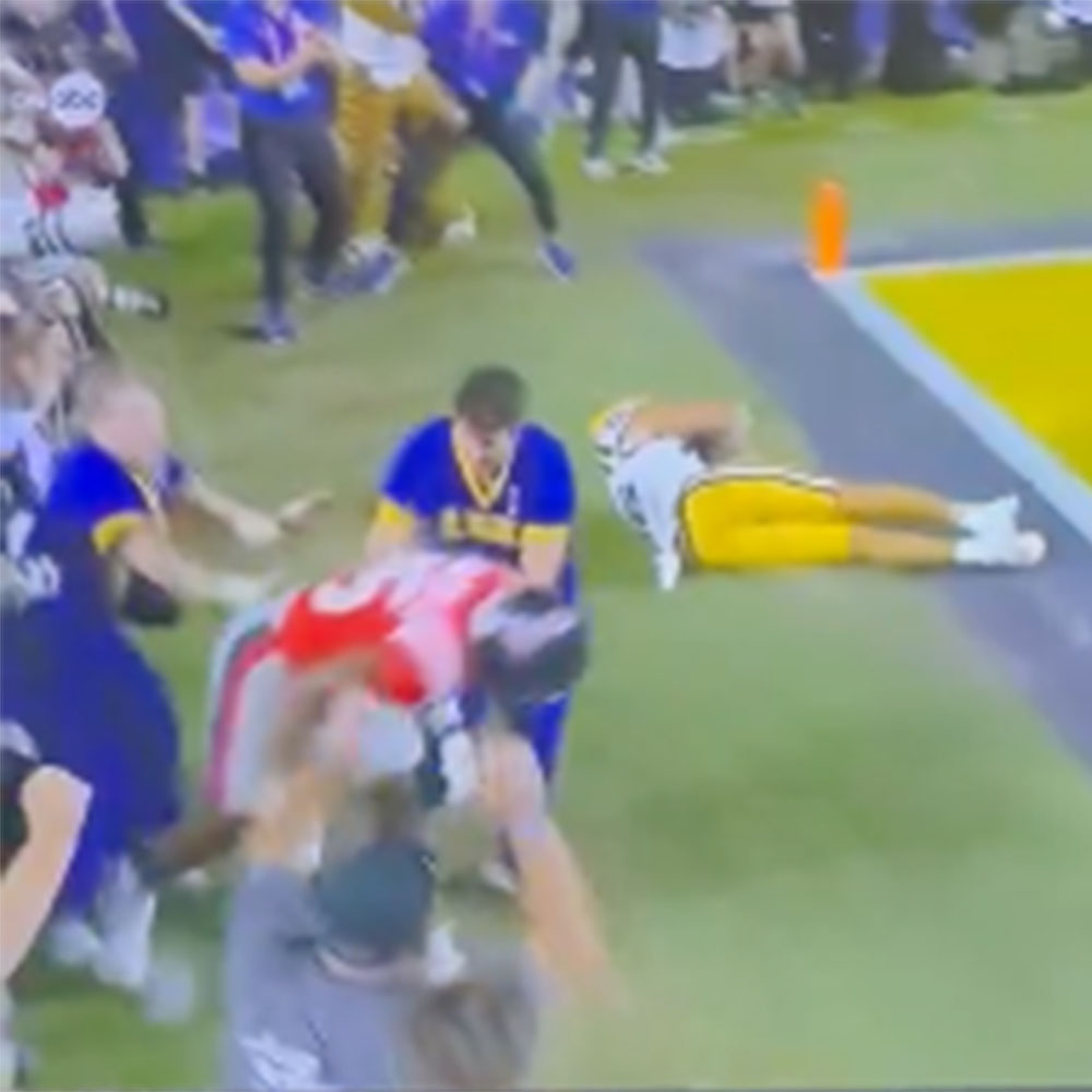 An LSU cheerleader appeared to shove Ole Miss defender Trey Washington with less than two minutes to play in a game against LSU at Tiger Stadium on Oct. 12, 2024. 