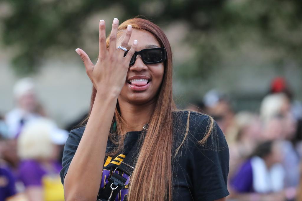 Angel Reese celebrates the Lady Tigers' national championship win at a parade in April 2023.