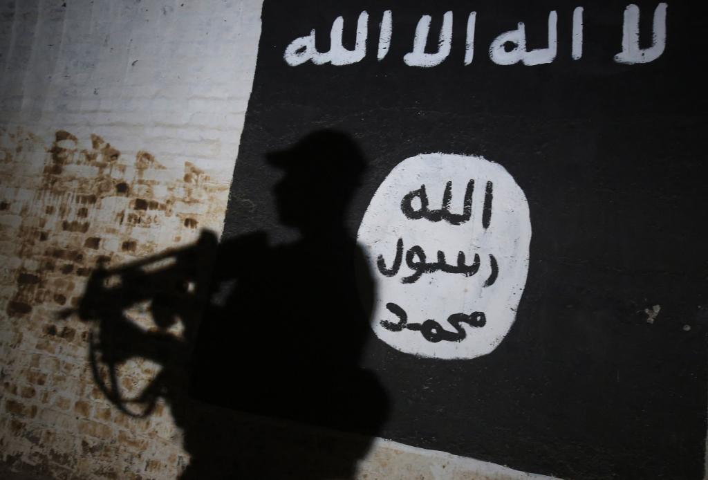 A mural of the ISIS logo is pictured