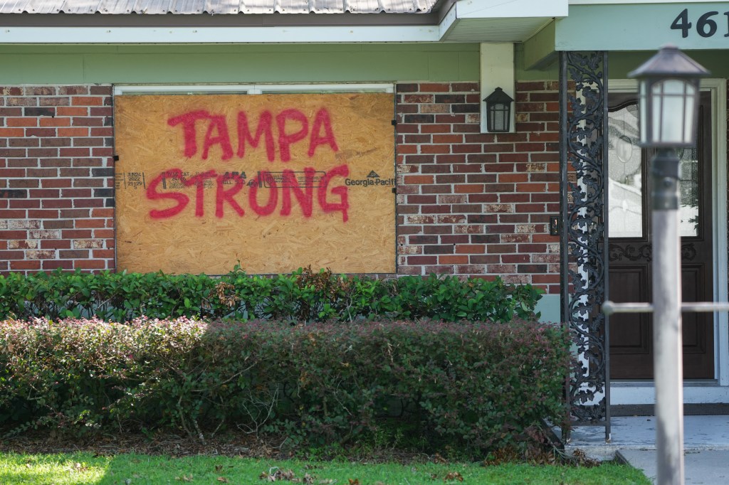 A boarded up building with the message "Tampa Strong" in Tampa on Oct. 8, 2024.