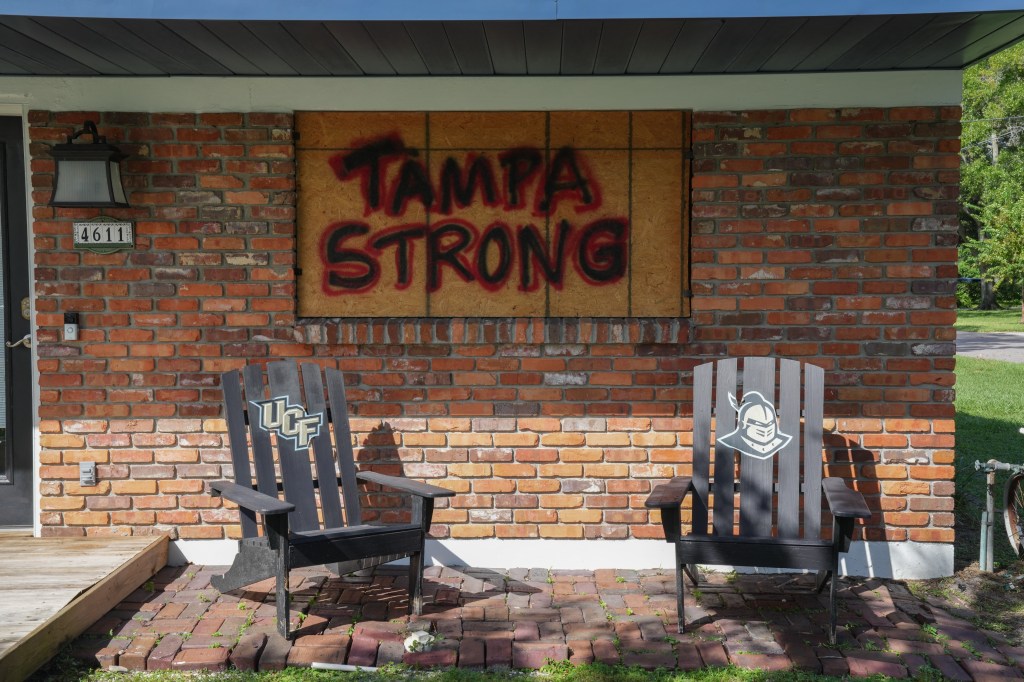 A "Tampa strong" message on a person's boarded up home in Tampa on Oct. 8, 2024.