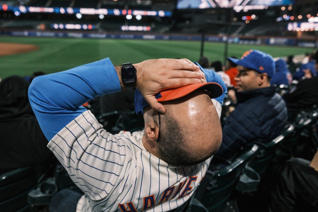 A Mets fan reacts in agony while at a watch party in Citi Field during the team's game 6 loss to the Dodgers on Oct. 20, 2024.