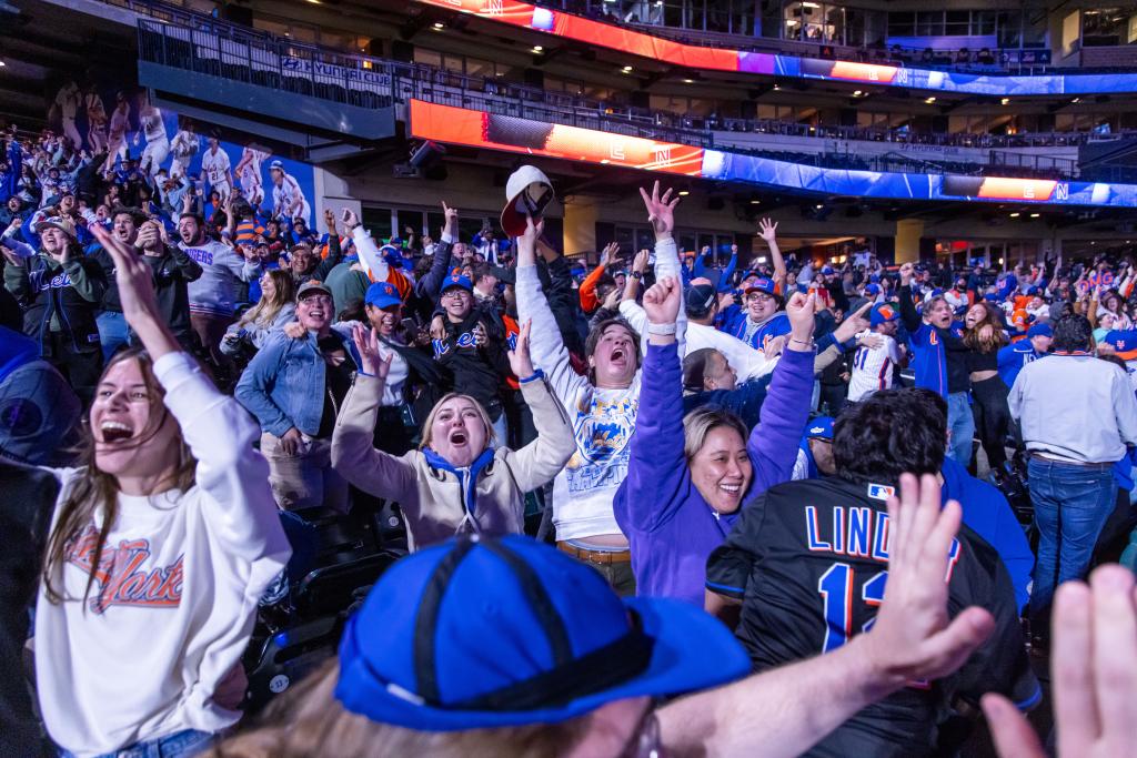 Mets fans celebrate at a watch party at Citi Field.