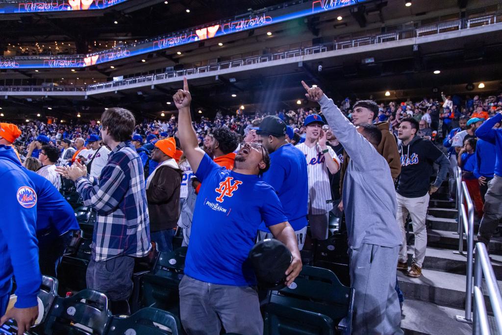 Mets fans celebrate at a watch party at Citi Field.