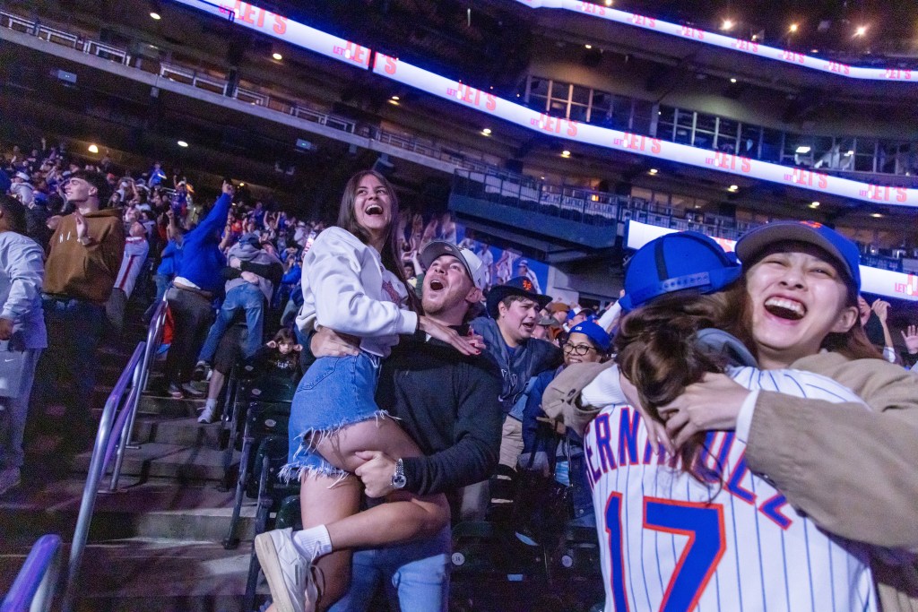 Mets fans celebrate at a watch party at Citi Field.