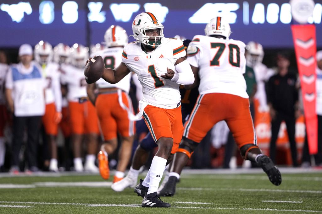 Miami Hurricanes quarterback Cam Ward (1) throws a pass against the California Golden Bears during the first quarter at California Memorial Stadium. 