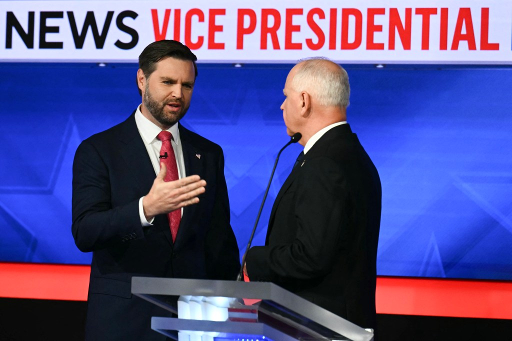 Vance and Walz talk together at the end of the Vice Presidential Debate on Oct. 1, 2024.  