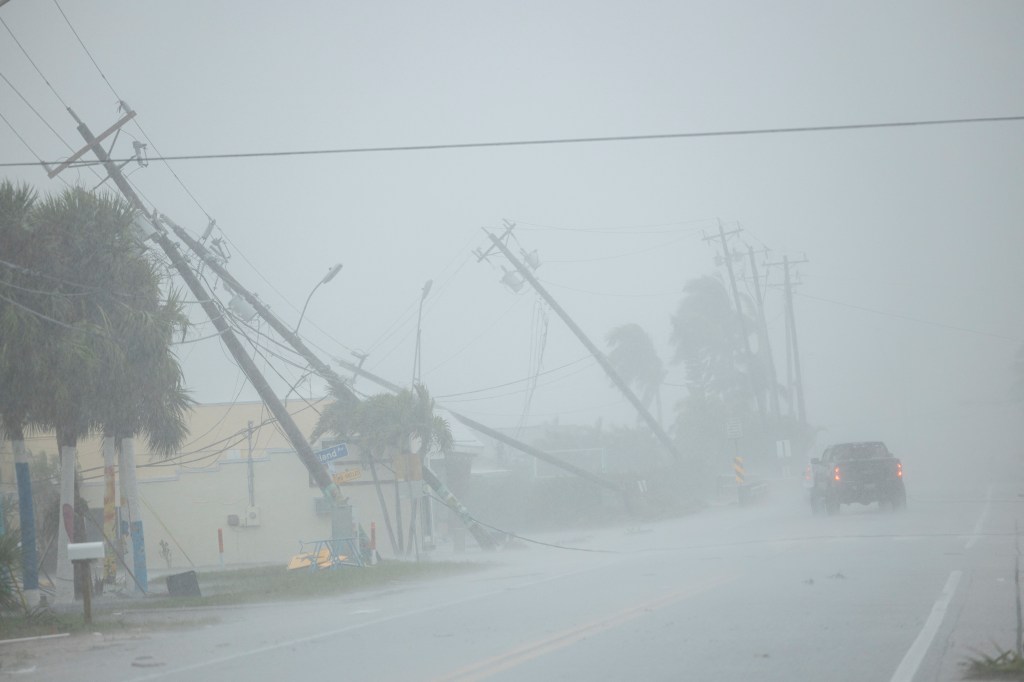 Utility poles knocked down by strong winds in Fort Myers.