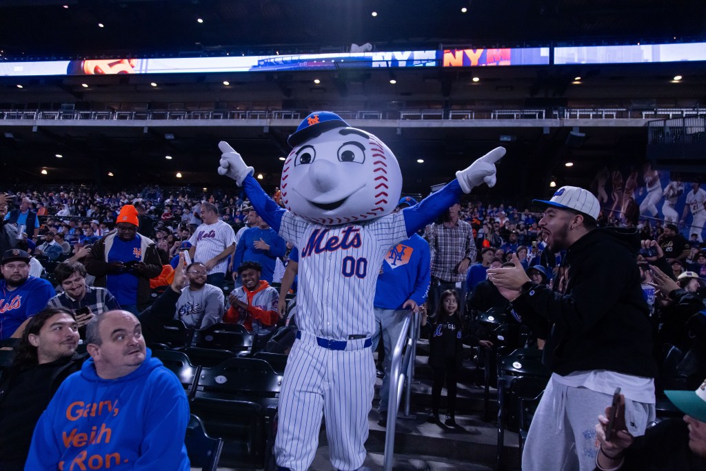 Mr. Met and Mets fans watch the playoffs during a watch party at Citi Field .