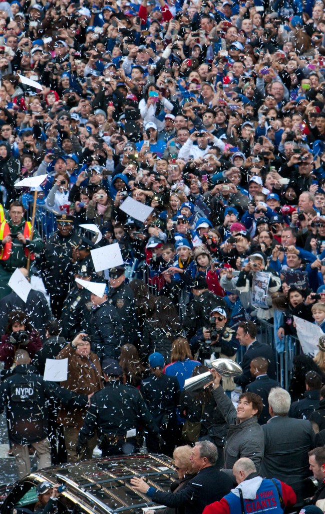 New York Giants Quarterback Eli Manning holds the Vince Lombardi trophy during the Super Bowl Championship ticker-tape parade Tuesday, Feb. 7, 2012, in New York. 