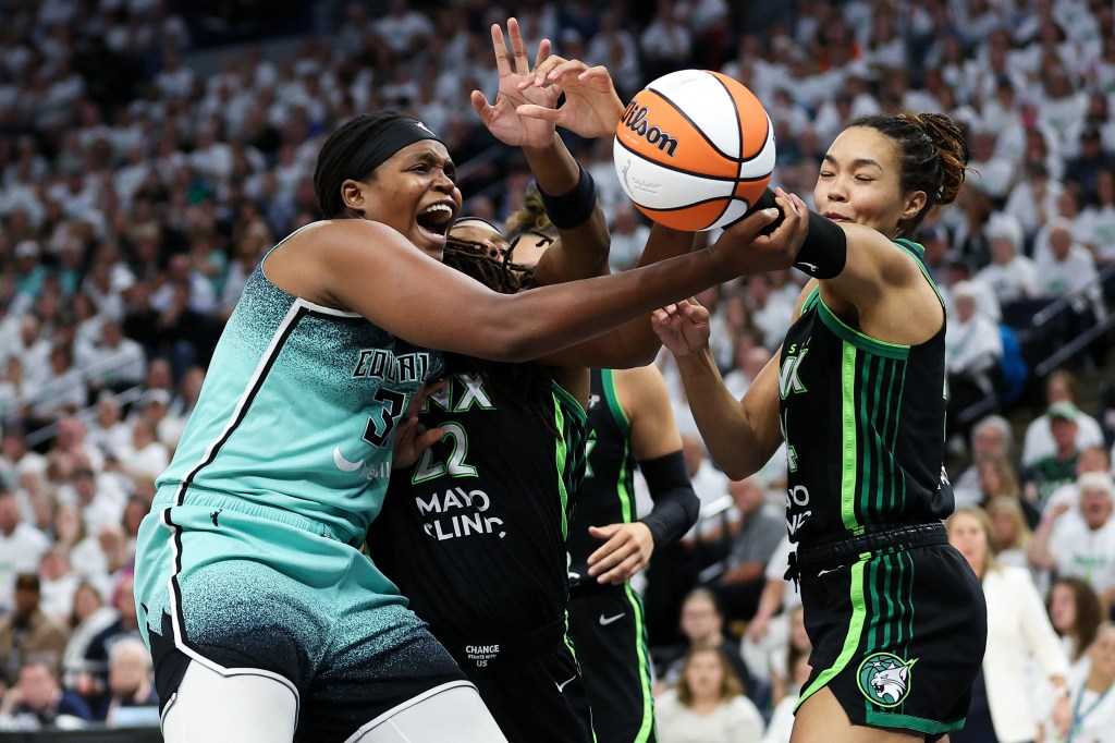 Liberty forward Jonquel Jones (35) and Minnesota Lynx forward Napheesa Collier (24) compete for the ball