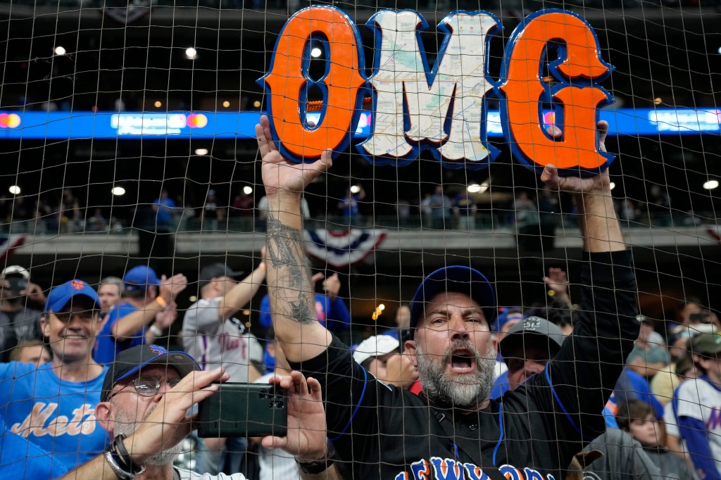 Mets fans celebrate at a watch party at Citi Field.