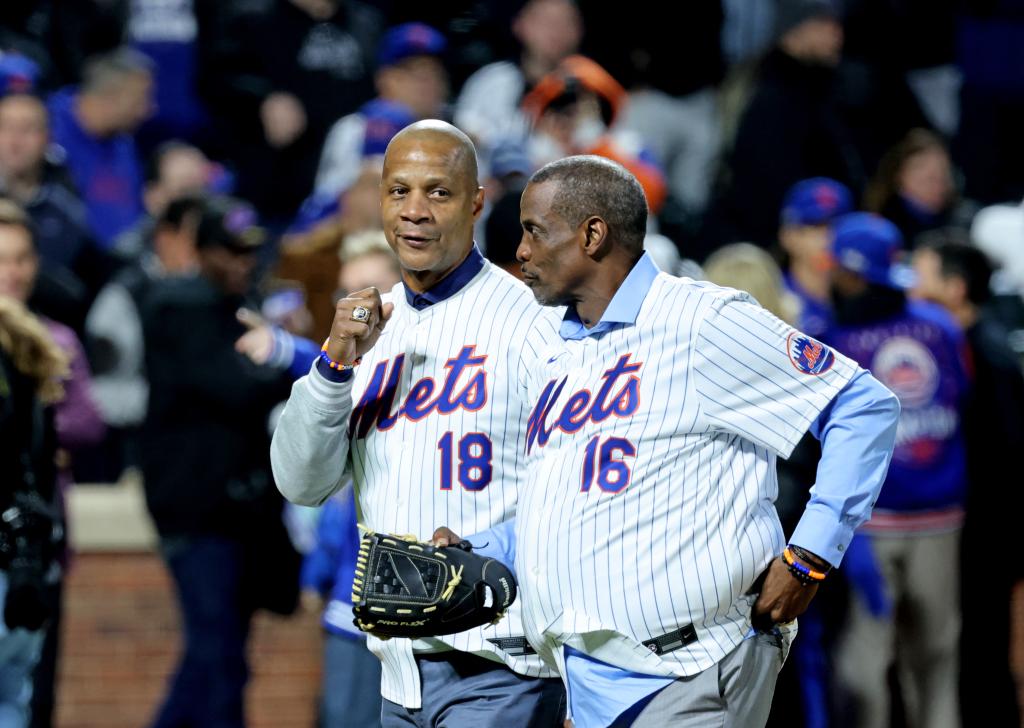 Darryl Strawberry and Doc Gooden, New York Mets greats, walking back to home plate after throwing the first pitch at Citi Field during NLCS Game 3 against the Los Angeles Dodgers