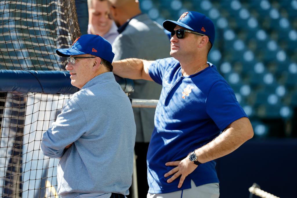 New York Mets owner Steve Cohen and manager Carlos Mendoza watching batting practice before a game against the Milwaukee Brewers