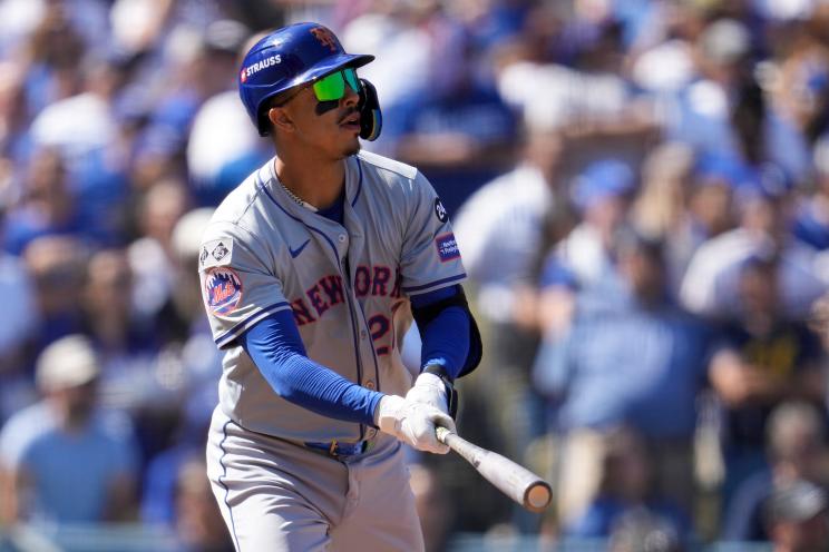 New York Mets' Mark Vientos watching his grand slam home run against the Los Angeles Dodgers in Game 2 of the NL Championship Series