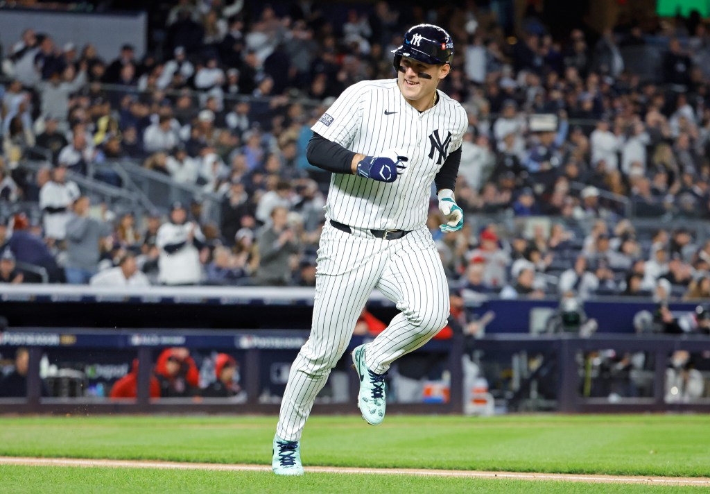 New York Yankees' Anthony Rizzo hitting a single during the second inning against the Cleveland Guardians in Game 1 of the 2024 ALCS at Yankee Stadium