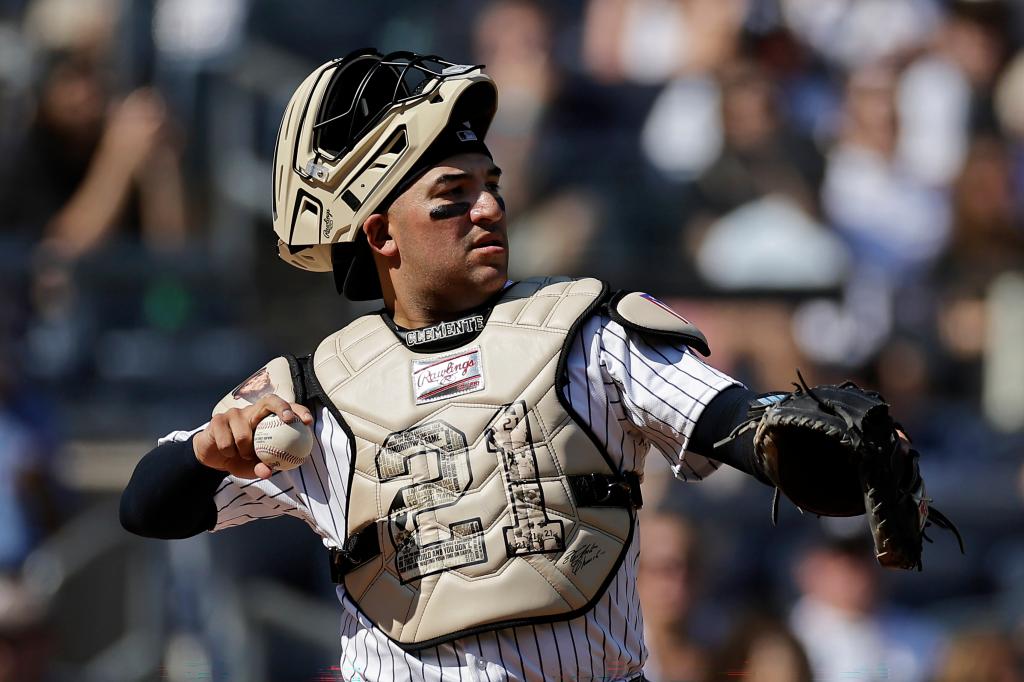 New York Yankees catcher Jose Trevino throws the ball while wearing catcher gear in honor of Roberto Clemente Day during the third inning of a baseball game against the Boston Red Sox, Sunday, Sept. 15, 2024, in New York.