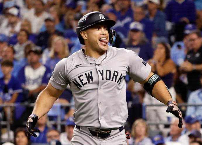 New York Yankees designated hitter Giancarlo Stanton reacts after connecting on a solo home run against the Kansas City Royals in the eighth inning during Game three of the American League Division Series (ALDS) at Kauffman Stadium in Kansas City, Missouri, USA, Wednesday, October 09, 2024.