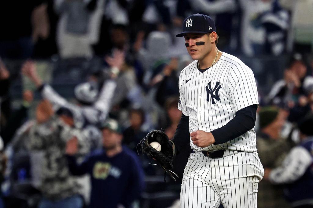 Oct 15, 2024; Bronx, New York, USA; New York Yankees first base Anthony Rizzo (48) celebrates after catching the last out to defeat the Cleveland Guardians in game two of the ALCS for the 2024 MLB Playoffs at Yankee Stadium. Mandatory Credit: Vincent Carchietta-Imagn Images