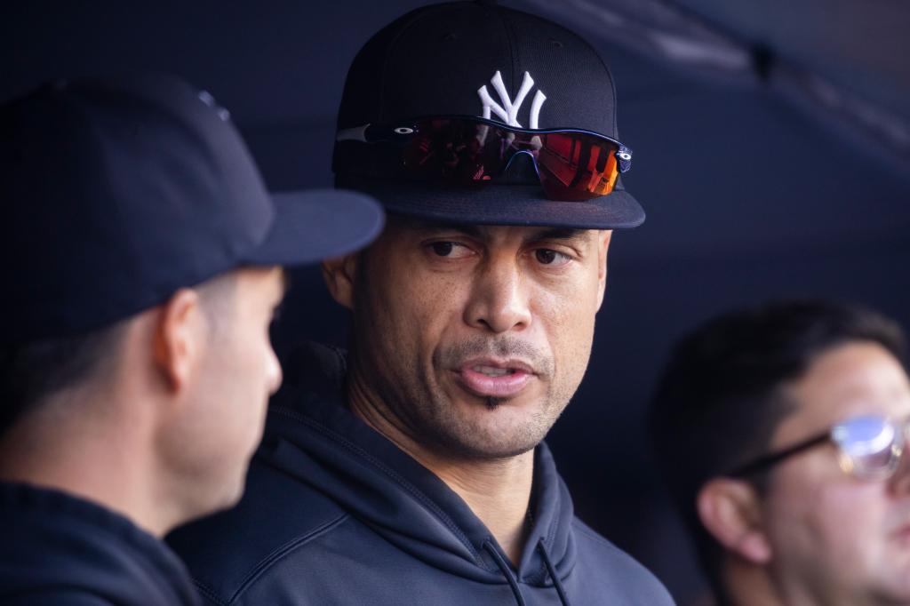 New York Yankees Giancarlo Stanton speaks with his teammate in the dugout during the sixth inning at Yankee Stadium, Thursday, April 20, 2023, in Bronx, NY. 