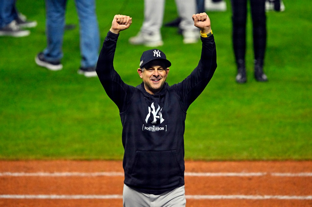 Aaron Boone celebrates after the Yankees' win over the Guardians on Oct. 19, 2024. 