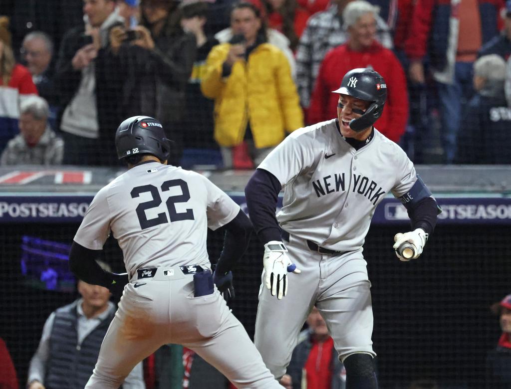 New York Yankees outfielder Juan Soto celebrating with Aaron Judge after hitting a 3-run homer in ALCS Game 5 at Progressive Field