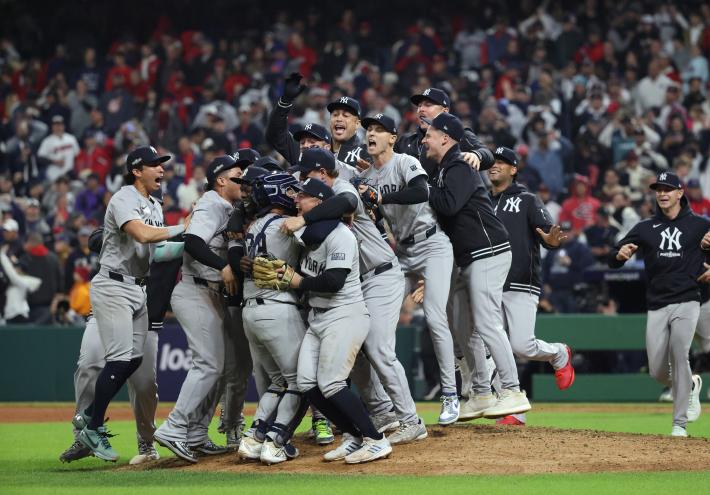 New York Yankees celebrating their victory over the Cleveland Guardians in the ALCS, Game 5, advancing to the World Series