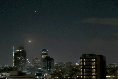 Missiles seen above Tel Aviv skyline.