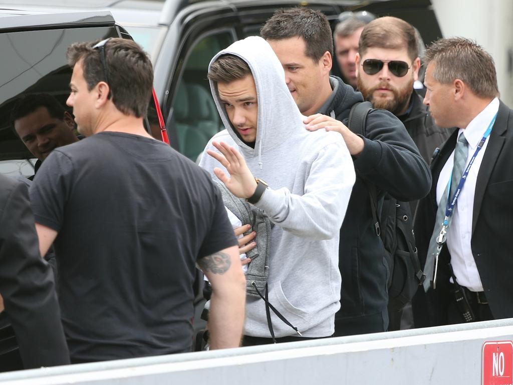 One Direction arrive at Sydney Airport on November 25, 2014.