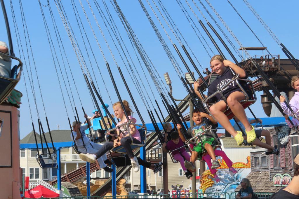 People ride the flying chair attraction at Gillian's Wonderland