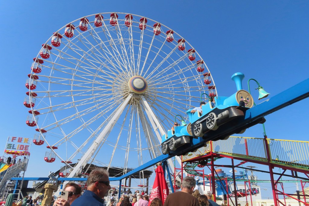 People wait in line to board rides at Gillian's Wonderland, the popular amusement park on the boardwalk in Ocean City, N.J., during its final day of operation